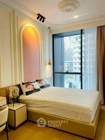 Luxurious bedroom with modern decor and city view, featuring elegant lighting and stylish furnishings.