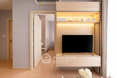 Modern living room with sleek wooden TV unit and ambient lighting