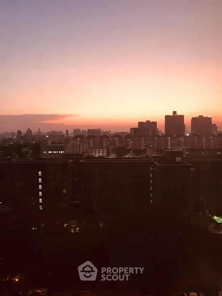 Stunning cityscape view at sunset with skyline silhouette, perfect for urban living enthusiasts.