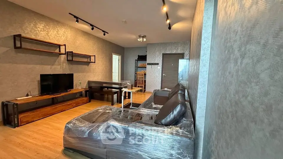 Modern living room with stylish decor and sleek furniture in a contemporary apartment.