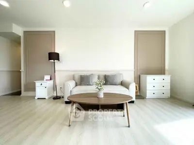 Bright and spacious living room with modern furniture and elegant decor.