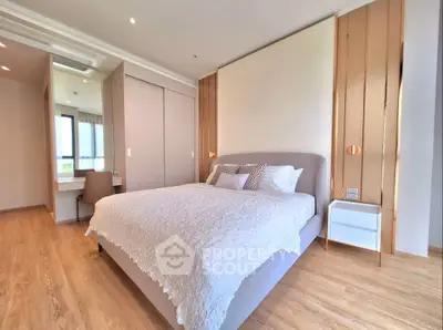 Spacious modern bedroom with elegant decor and natural light