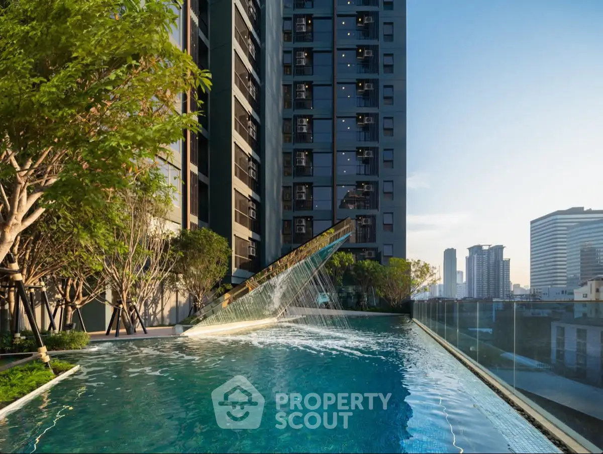 Luxurious high-rise building with stunning rooftop pool and city skyline view.