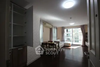 Spacious living room with modern furniture and large windows for natural light.