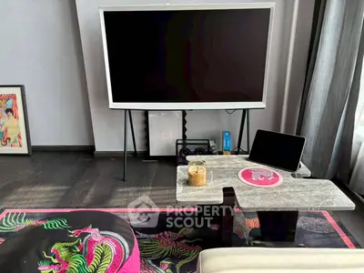 Stylish living room with modern TV setup and vibrant decor