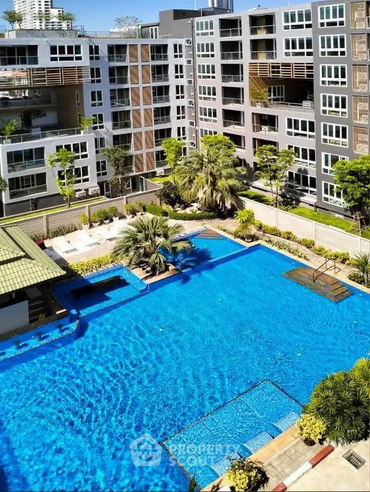 Luxurious apartment complex with stunning pool and modern architecture