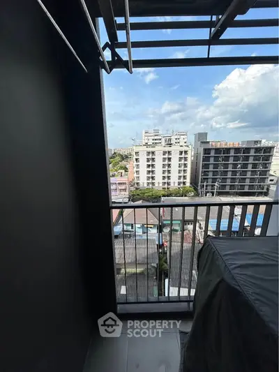 Urban balcony with city view, perfect for relaxation and enjoying the skyline.