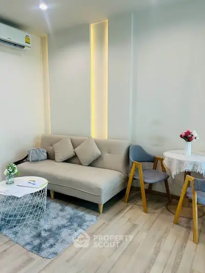 Modern living room with stylish furniture and cozy decor, perfect for relaxation and entertaining guests.