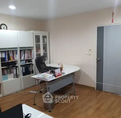 Spacious home office with modern desk and ample storage