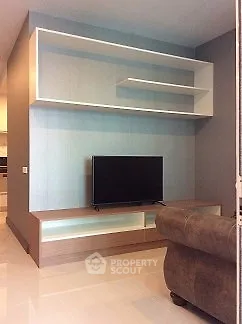 Modern living room with sleek TV stand and stylish shelving unit