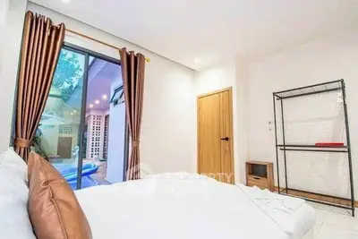 Spacious bedroom with garden view and modern decor