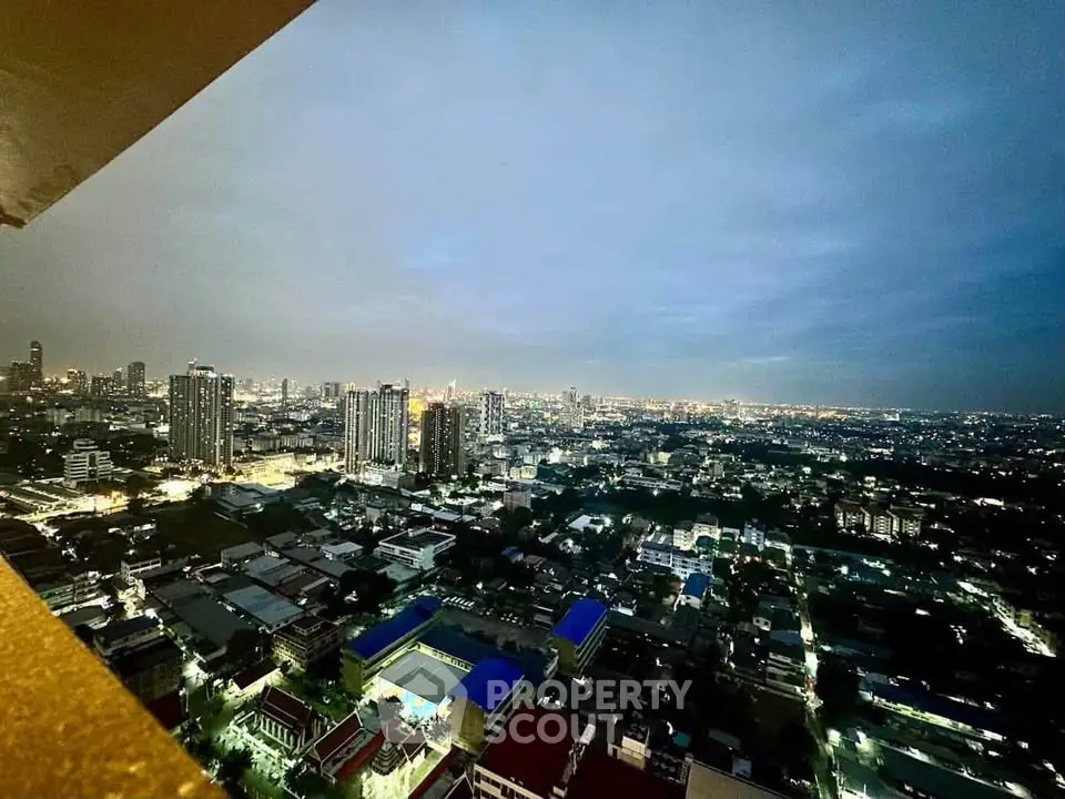 Stunning cityscape view from high-rise apartment balcony at dusk, showcasing vibrant urban skyline.