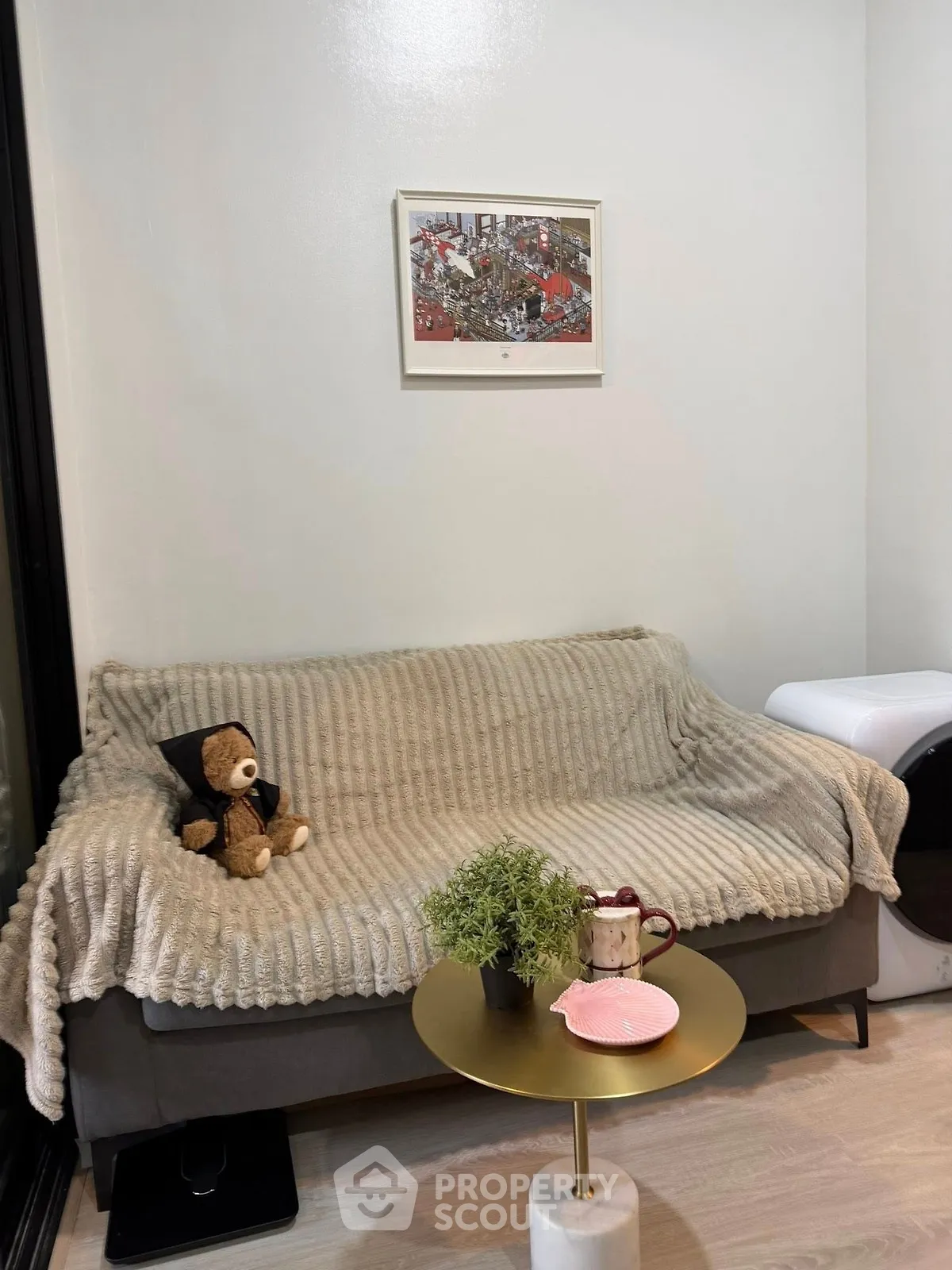 Cozy living room with plush sofa, teddy bear, and modern decor