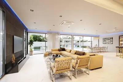 Luxurious open-plan living room with modern decor and expansive garden views.