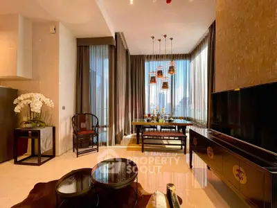 Luxurious living room with elegant decor and city view, featuring stylish furniture and floor-to-ceiling windows.