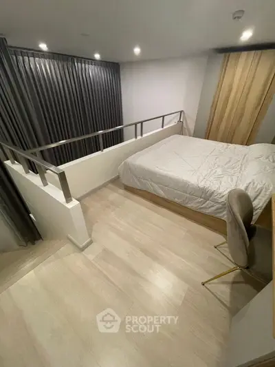 Modern bedroom with sleek design and cozy ambiance, featuring a stylish bed and elegant decor.