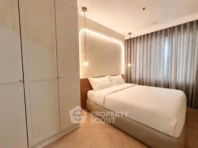 Modern bedroom with elegant lighting and spacious wardrobe
