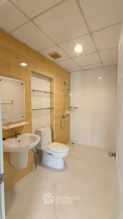 Modern bathroom with sleek fixtures and neutral tile design
