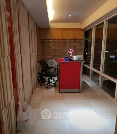 Modern office lobby with sleek design and large windows for natural light.