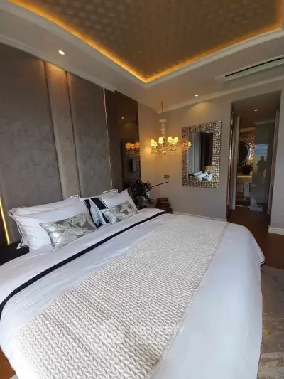 Luxurious bedroom with elegant decor and ambient lighting