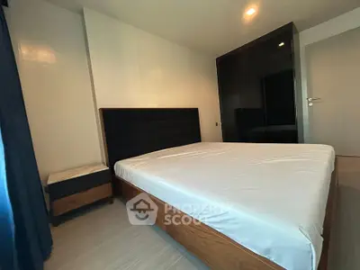 Spacious bedroom with modern furnishings and ample natural light