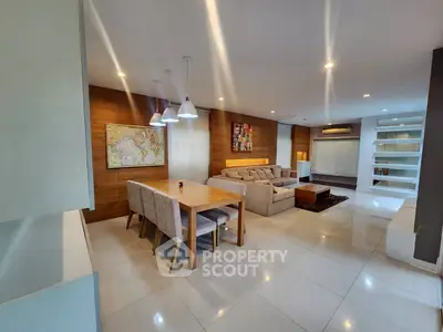 Spacious modern living room with elegant dining area and cozy seating.