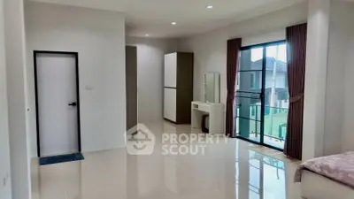 Spacious modern bedroom with large windows and elegant decor