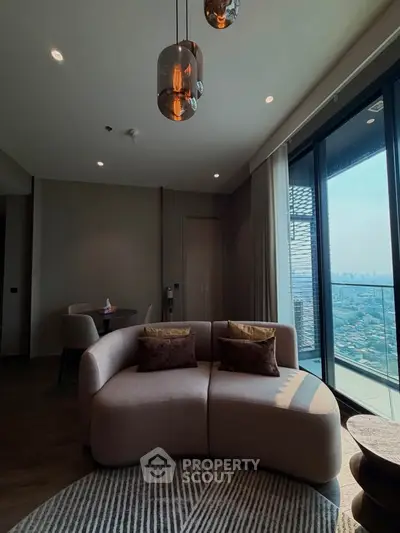 Luxurious living room with modern sofa and stunning city view from large windows.