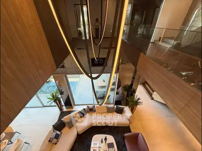 Luxurious modern living room with high ceilings and elegant lighting