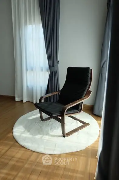 Cozy corner with elegant chair and natural light in modern home