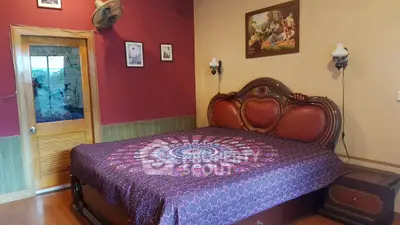 Cozy bedroom with elegant wooden furniture and vibrant decor