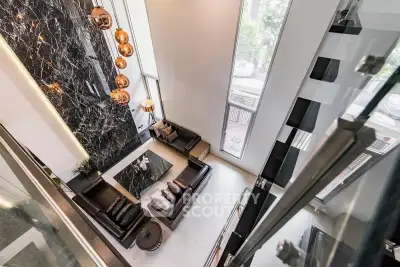 Luxurious modern living room with high ceilings and elegant decor