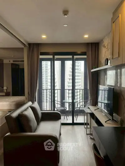 Modern living room with balcony view in high-rise apartment