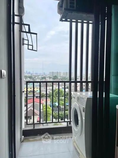 Charming balcony with city view and washing machine, perfect for urban living convenience.