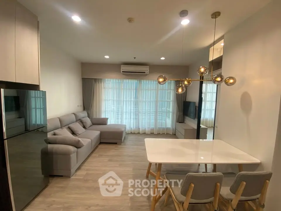 Modern living room with stylish furniture and elegant lighting in a cozy apartment.