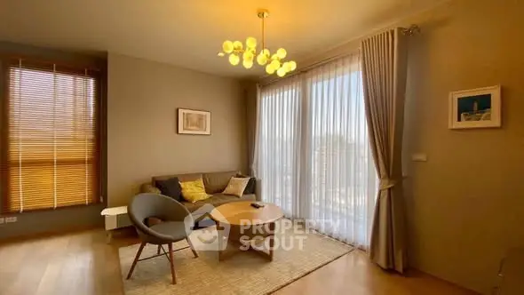 Chic living room with modern lighting and floor-to-ceiling windows