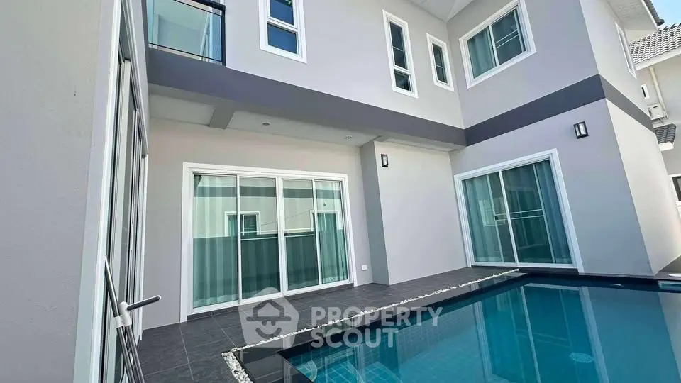 Modern residential building with private pool and sleek design