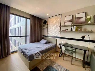 Modern bedroom with large window and stylish decor in urban apartment