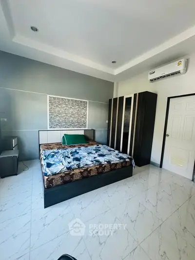 Spacious bedroom with modern design and air conditioning