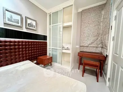 Cozy bedroom with elegant decor and built-in wardrobe
