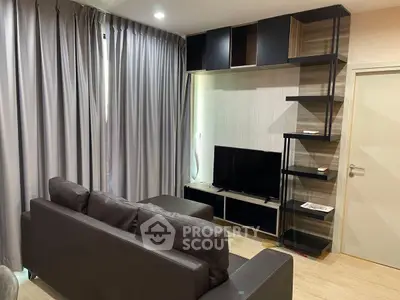 Modern living room with sleek furniture and entertainment center