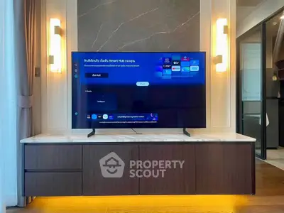 Modern living room with sleek TV unit and ambient lighting