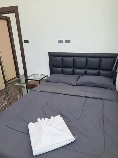 Modern bedroom with sleek design and luxurious bedding