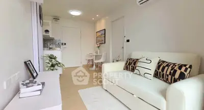 Modern living room with cozy sofa and stylish decor in a bright apartment.