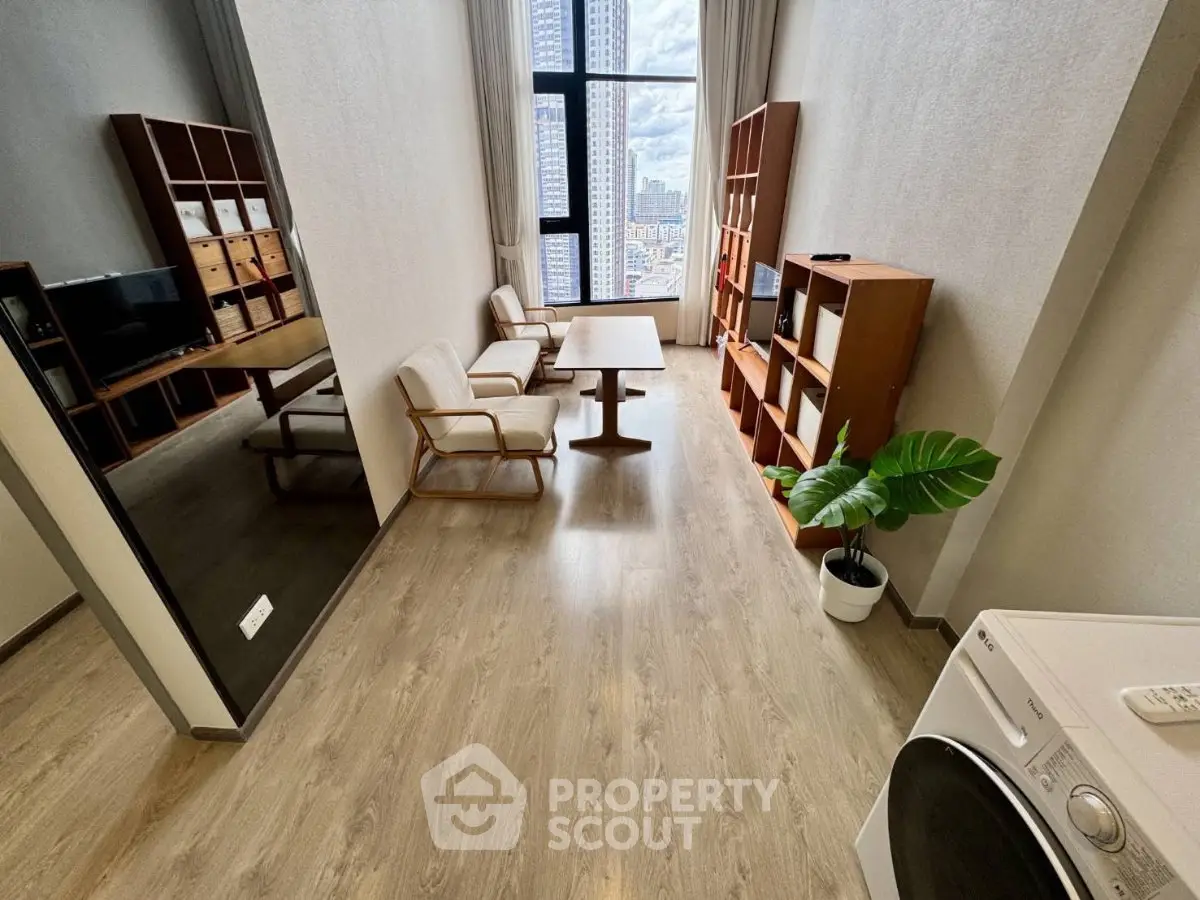Spacious modern living room with high ceilings and city view, featuring elegant furniture and wooden flooring.