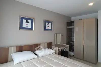 Modern bedroom with stylish decor and ample storage space