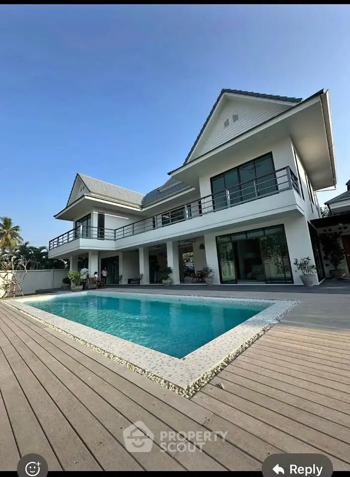 Luxurious modern villa with private pool and spacious deck area, perfect for relaxation and entertainment.