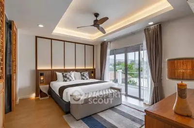 Luxurious bedroom with modern decor and balcony view, featuring elegant lighting and stylish furnishings.
