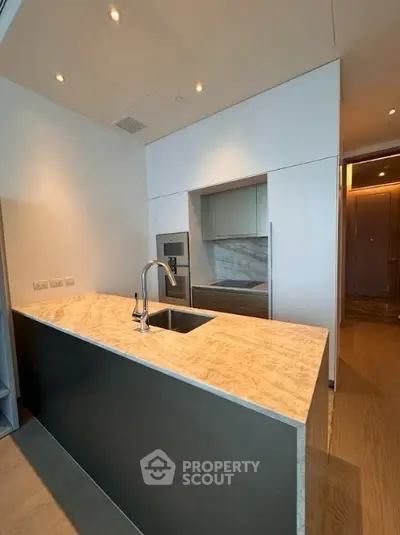 Modern kitchen with sleek design and marble countertop