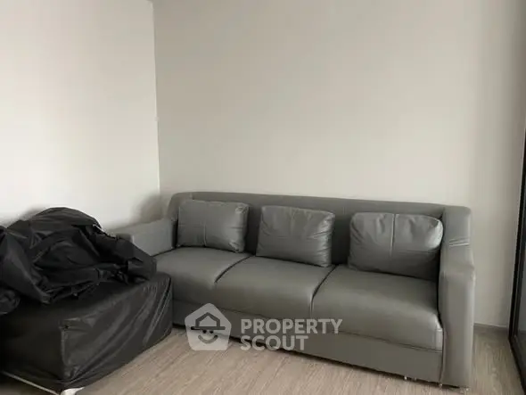 Modern living room with sleek gray sofa and minimalist decor